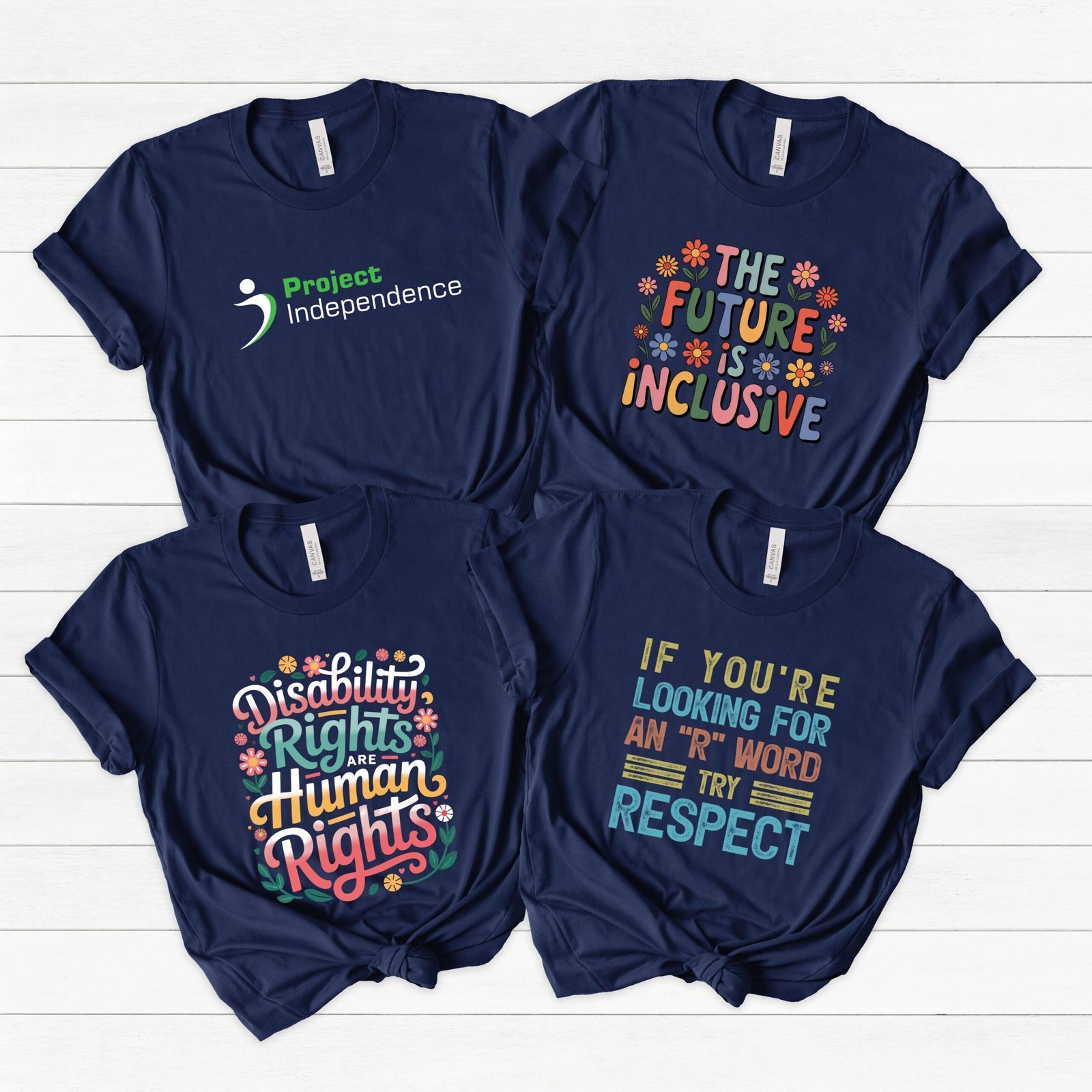 four navy blue tshirts with Project Independence logo and advocacy designs